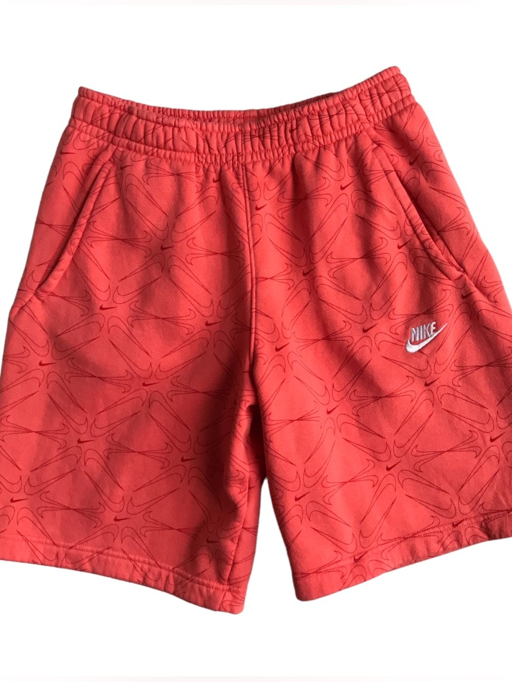 Nike Coral Athletic Shorts with Subtle Swoosh Pattern